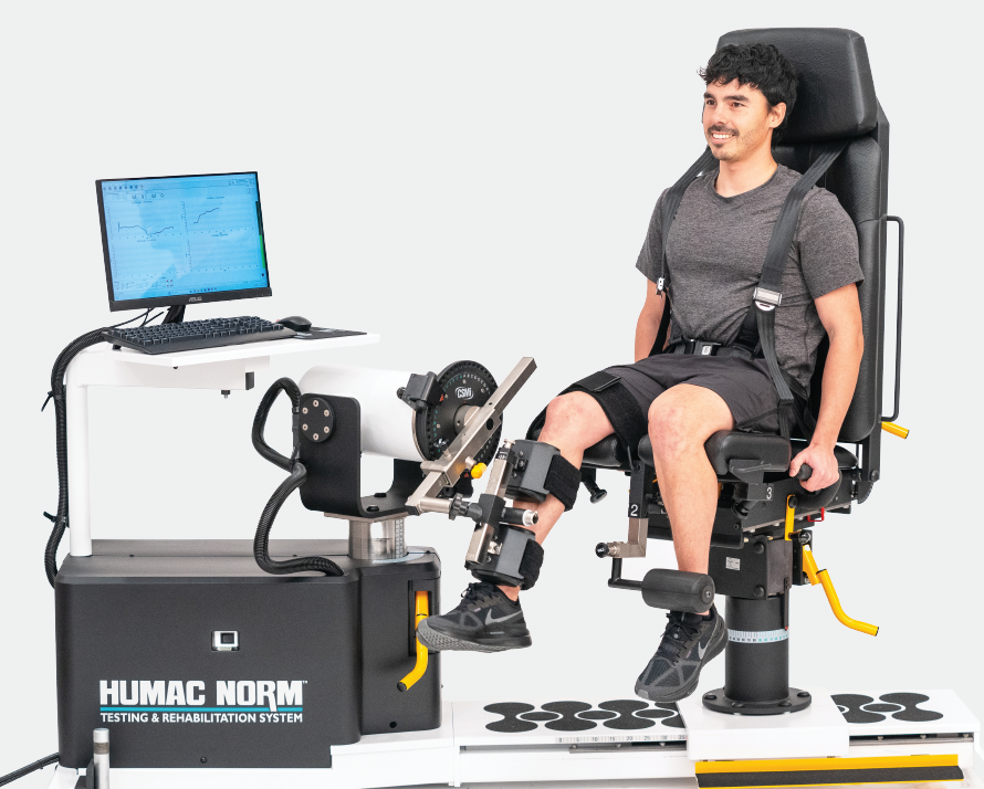athlete performing isokinetic exercise on machine